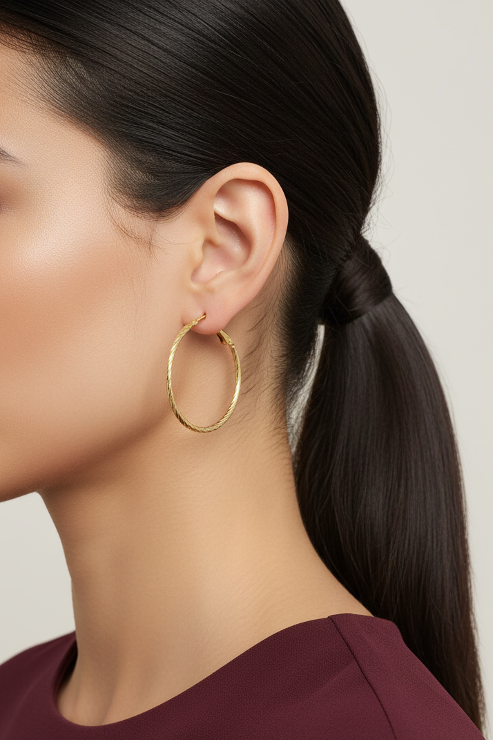 Model wearing Gold Medium 1.50" Hoop Lightweight Pierced Earring - Lilylin Designs