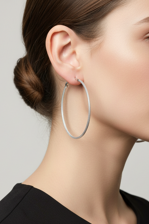 Model wearing 2.5 inch textured silver hoop earring - Lilylin Designs