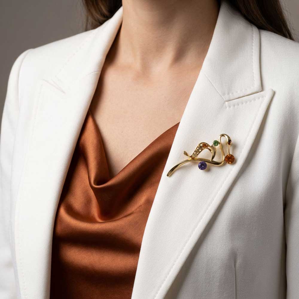 Model wearing Abstract crystal swan pin on a white jacket - Lilylin Designs