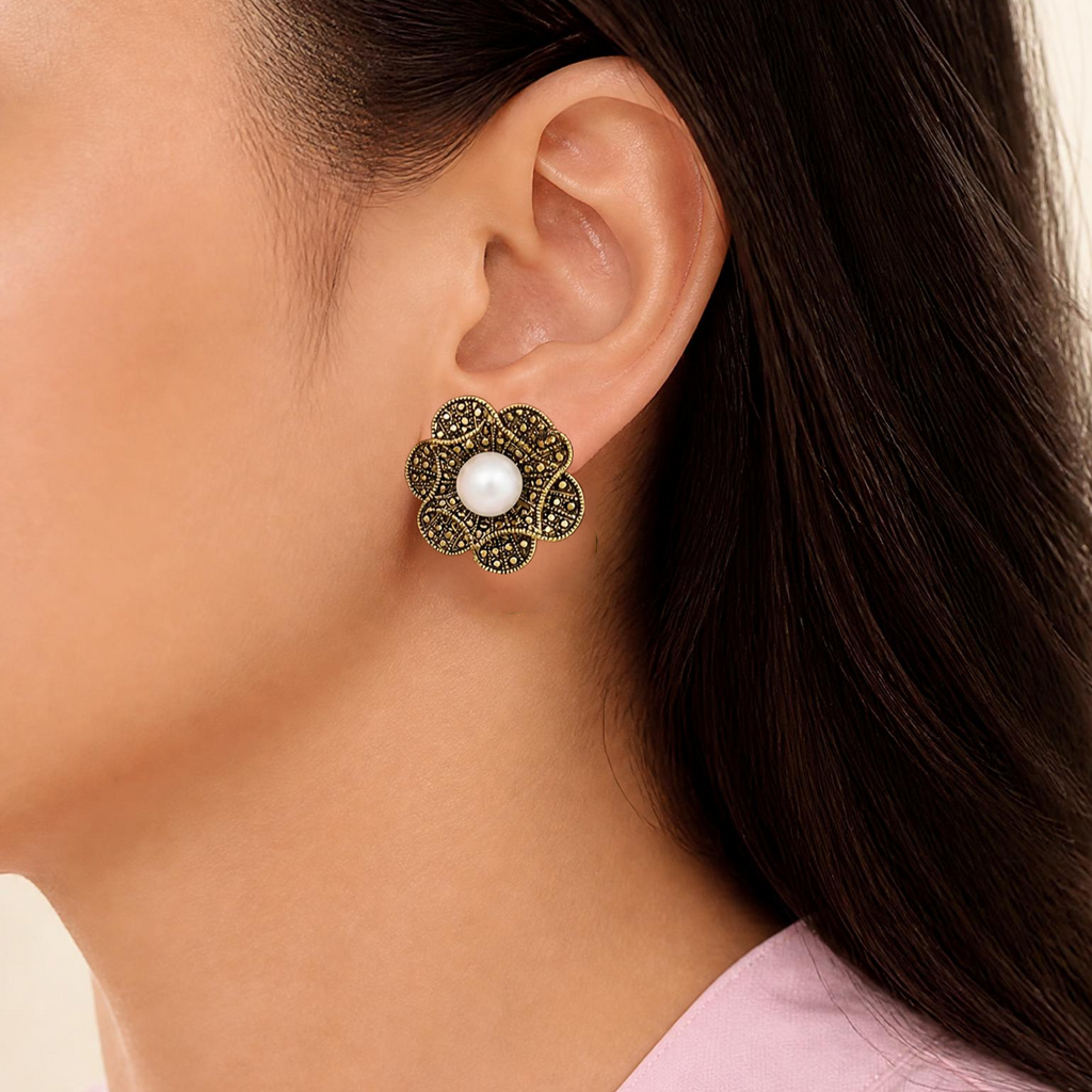 Model wearing antique gold - tone flower with white pearl pierced earring - Lilylin Designs