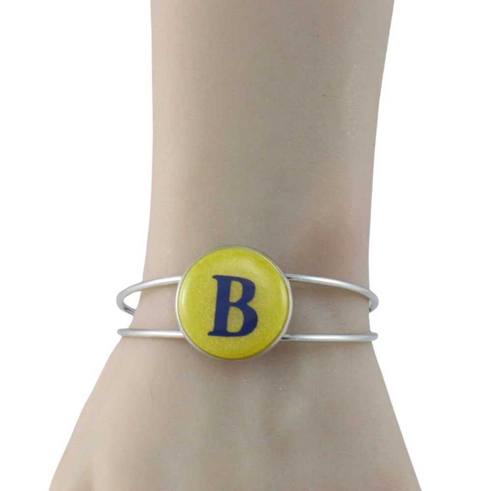 Bracelet with a yellow button featuring the letter 'B' on a mannequin arm - Lilylin Designs