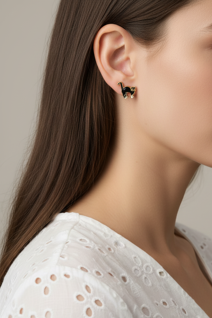 Model wearing black and white cloisonne cat earring - Lilylin Designs