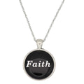 A silver chain necklace with a round pendant featuring a black background and the word 'Faith' in white script, shown on a plain white background - Lilylin Designs