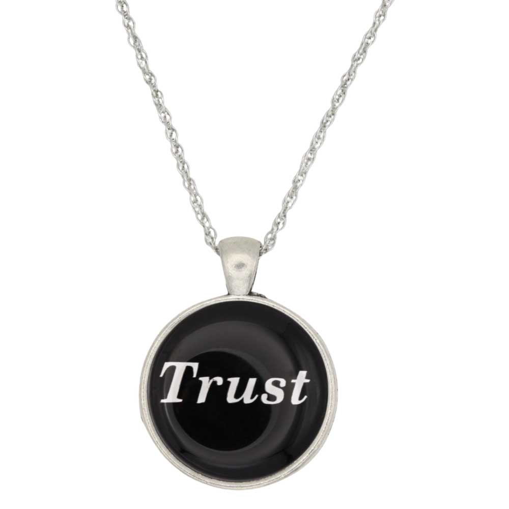 A silver chain necklace with a round pendant featuring a black background and the word 'Trust' in white script, shown on a plain white background - Lilylin Designs