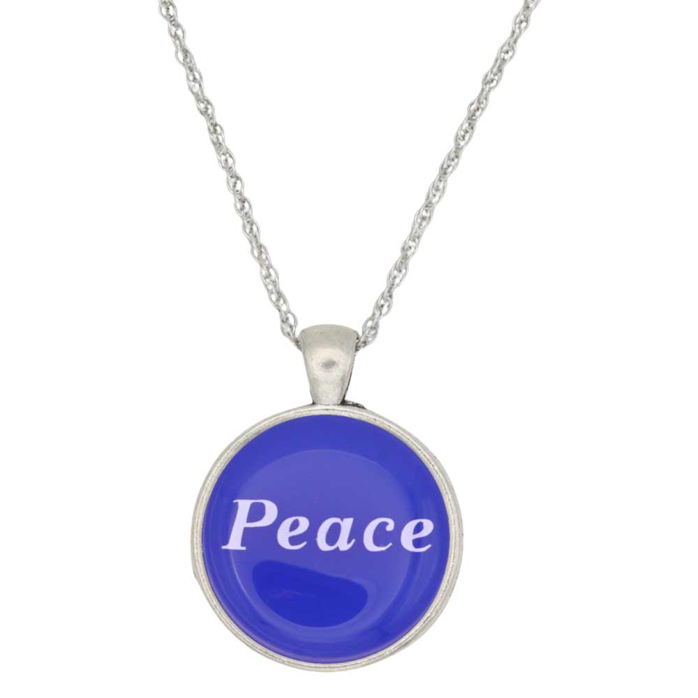 A silver chain necklace with a round pendant featuring a vibrant blue face with the word 'Peace' written in white script, set against a plain white background - Lilylin Designs