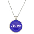 A silver chain necklace with a round pendant featuring a vibrant blue face with the word 'Hope' printed in white, set against a plain white background - Lilylin Designs