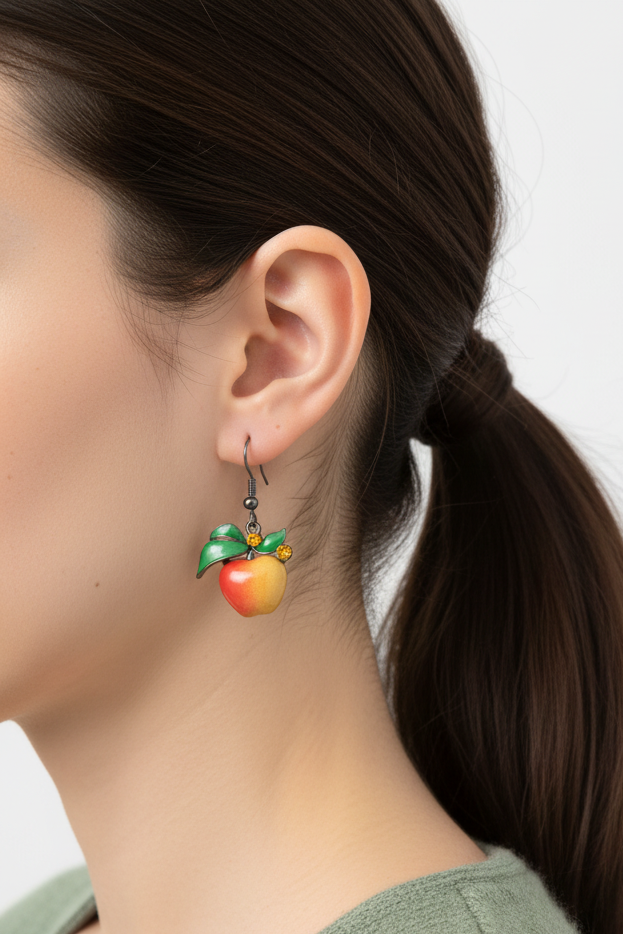 Model wearing enamel apple earring with topaz crystals - Lilylin Designs