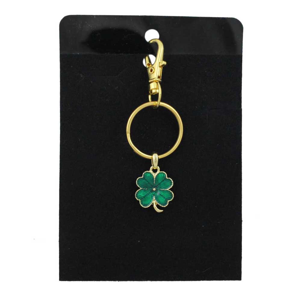 Gold keychain with a green 4 leaf clover charm on a black card - Lilylin Designs