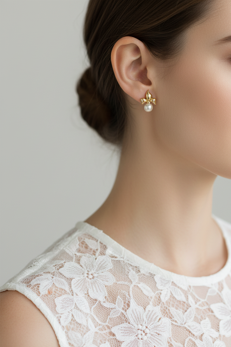 Model wearing fleur de lis pearl earring - Lilylin Designs