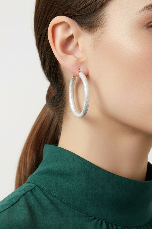 Model wearing 1.5" frosted silver -tone hoop earring - Lilylin Designs
