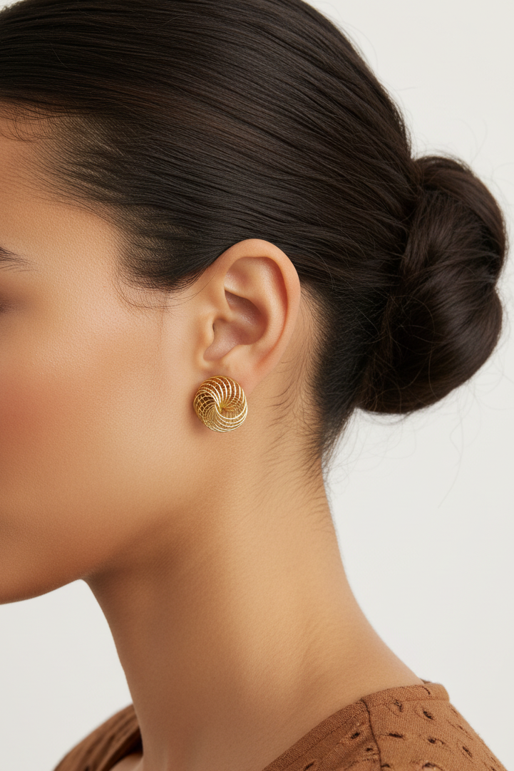 Model wearing gold spiral earring - Lilylin Designs