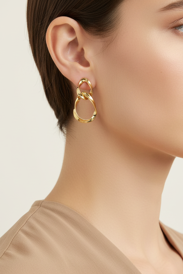 Model wearing gold intertwined teardrop earring - Lilylin Designs