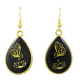Teardrop-shaped earrings with gold butterfly and lotus designs on black background - Lilylin Designs