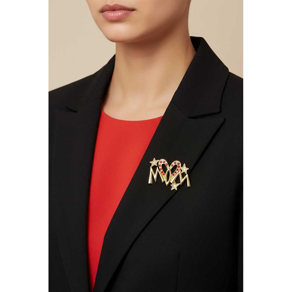Model wearing gold mom pin with red crystal elongated heart on a black jacket - Lilylin Designs