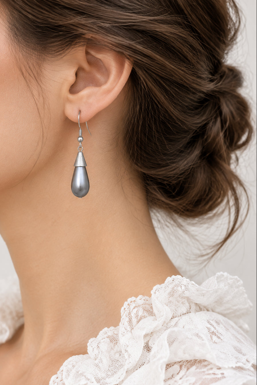 Model wearing gray teardrop pearl dangling pierced earring - Lilylin Designs