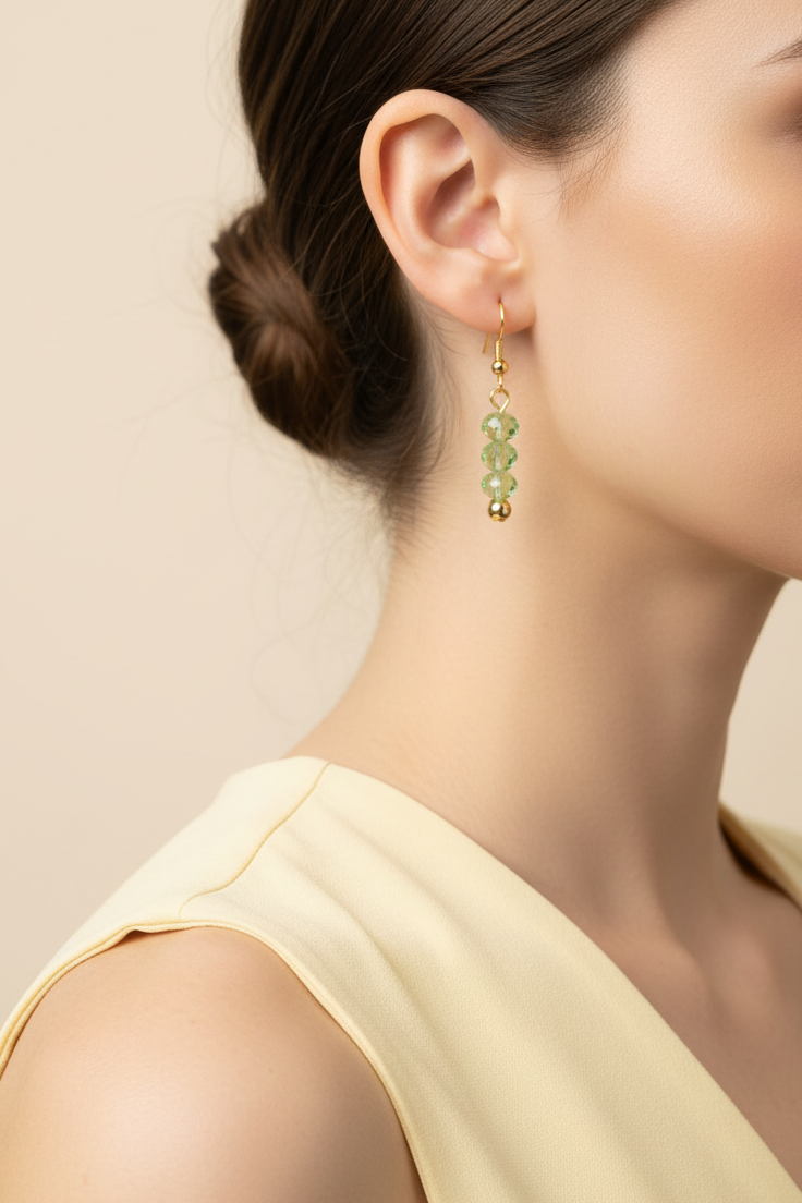 Model wearing green faceted bead earring - Lilylin Designs