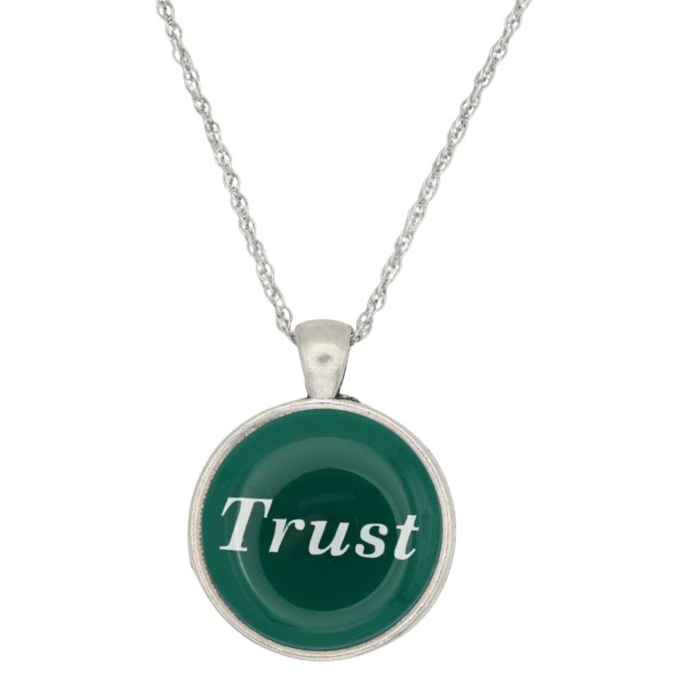 A silver chain necklace with a round pendant featuring a dark green background and the word 'Trust' in white script, set against a plain white background - Lilylin Designs