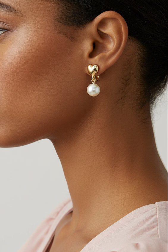 Model wearing gold heart with 8MM white pearl clip earring - Lilylin Designs