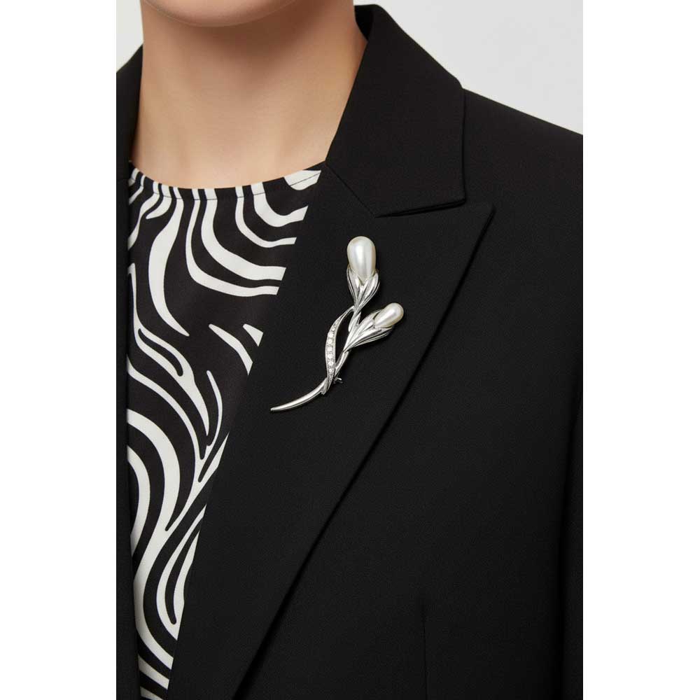 Model wearing 2 pearl buds brooch pin  on a black jacket with a black and white top - Lilylin Designs