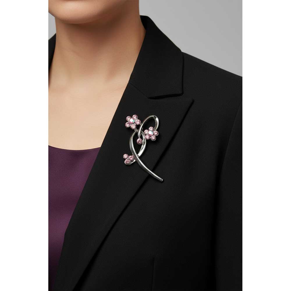 Model wearing 2 purple crystal flower in a loop brooch pin on a black jacket with a purple blouse - Lilylin Designs
