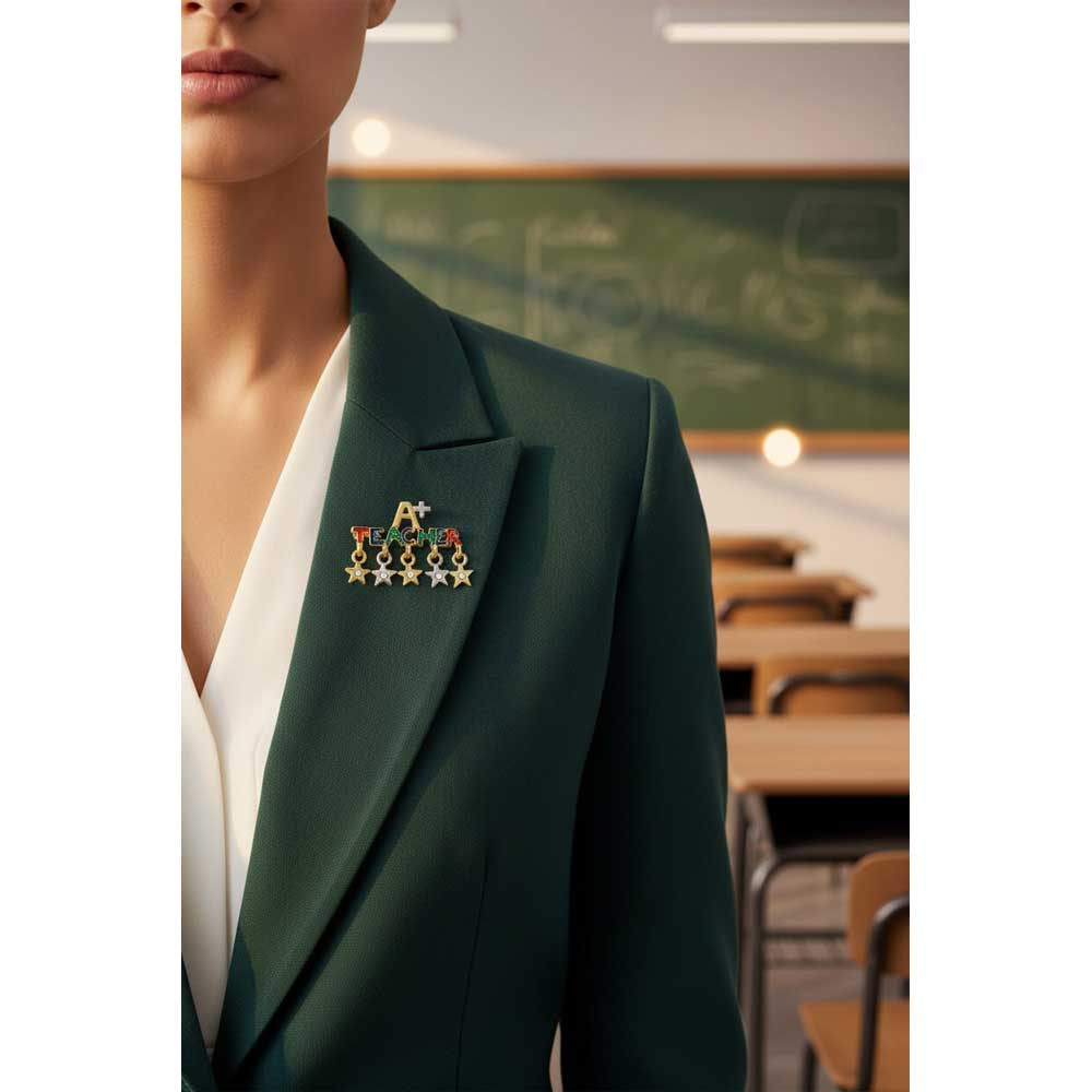 Model wearing A+ teacher brooch pin on a green jacket in a classroom setting - Lilylin Designs