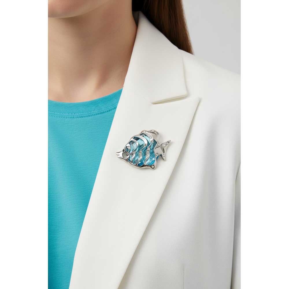 Model wearing Aqua blue angel fish brooch pin on a white jacket - Lilylin Designs
