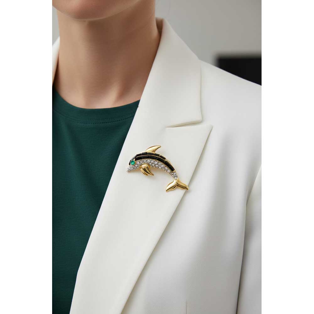 Model wearing Black dolphin brooch pin on a white jacket with a green shirt - Lilylin Designs