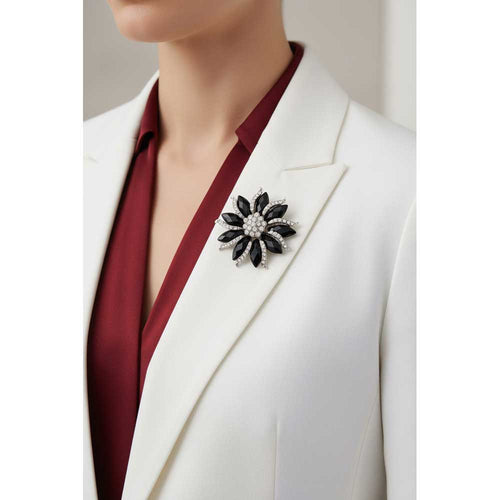 Model wearing Black marquise flower brooch pin on a white jacket with a red shirt - Lilylin Designs