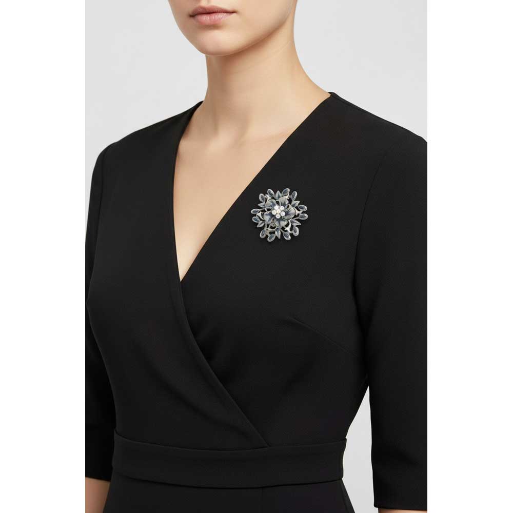 Model wearing Blue and gray flower and leaves brooch pin on a black wrap dress - Lilylin Designs