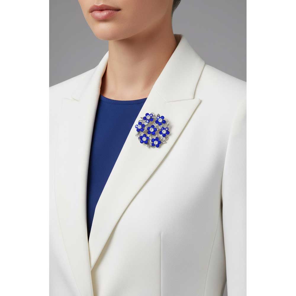 Model wearing Blue and white daisies brooch pin on a white jacket with a blue shirt - Lilylin Designs