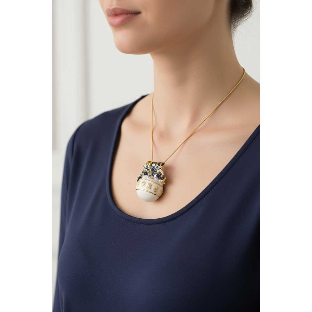 Model wearing Blue and white ornament necklace with a navy blue top - Lilylin Designs