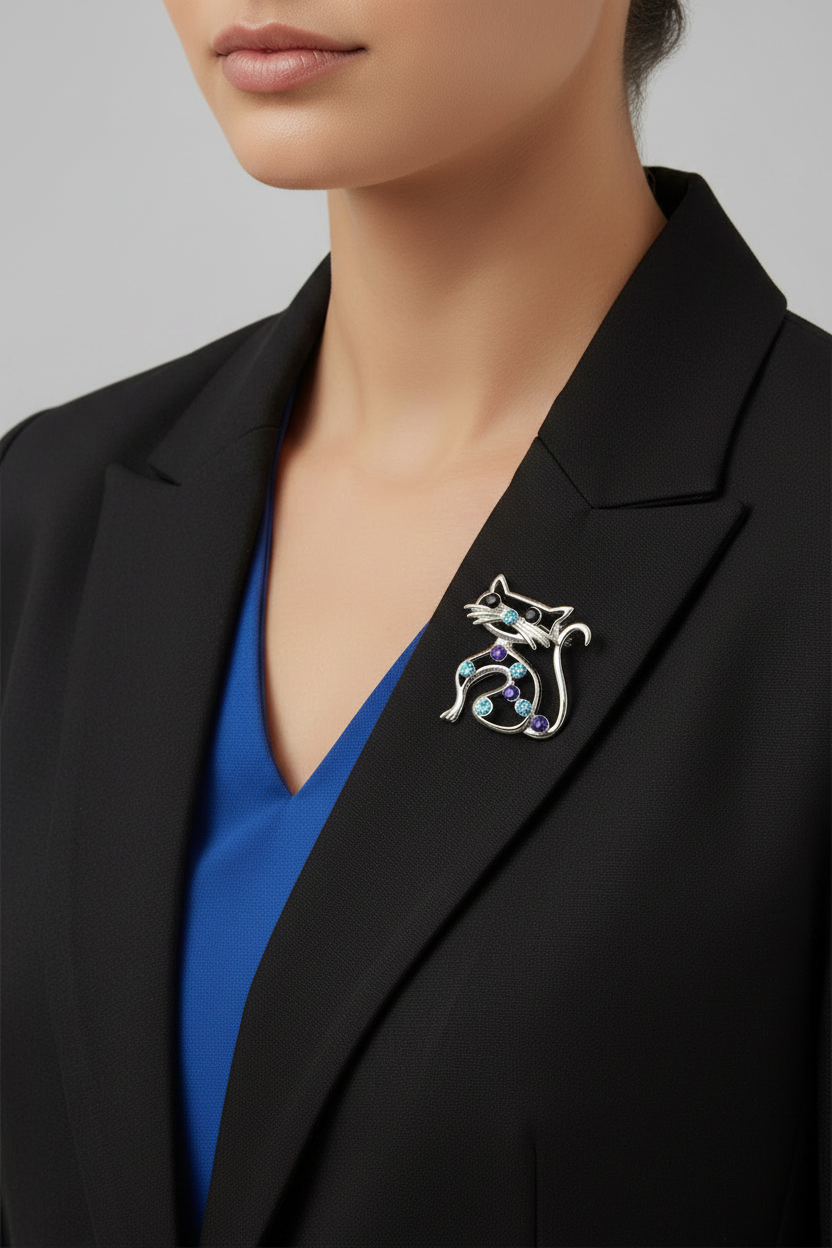Model wearing blue crystal cat brooch on a black jacket - Lilylin Designs