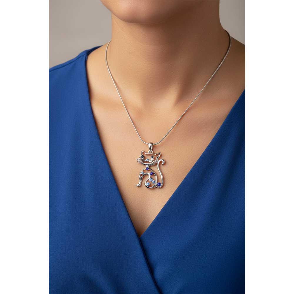 Model wearing Blue crystal cat necklace with a blue top - Lilylin Designs