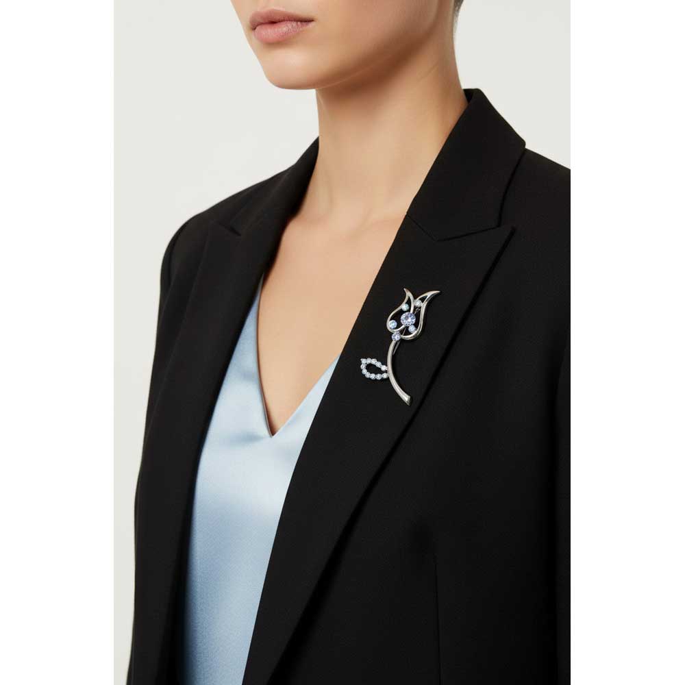 Model wearing Blue crystal tulip brooch pin on a black jacket with a light blue top - Lilylin Designs