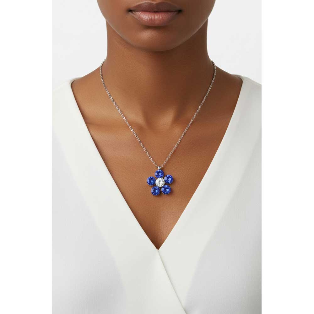Model wearing Blue daisy necklace with a white top - Lilylin Designs