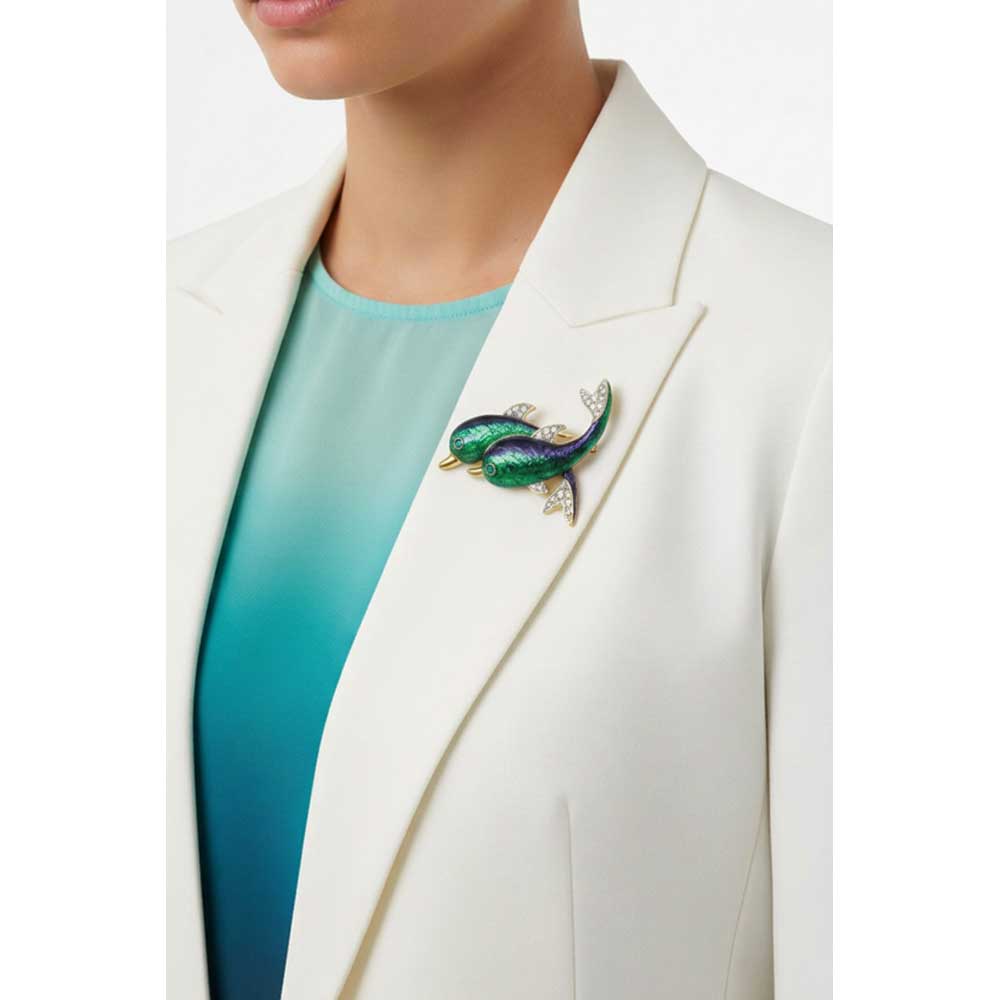 Model wearing Blue green dolphins brooch pin on a white jacket - Lilylin Designs