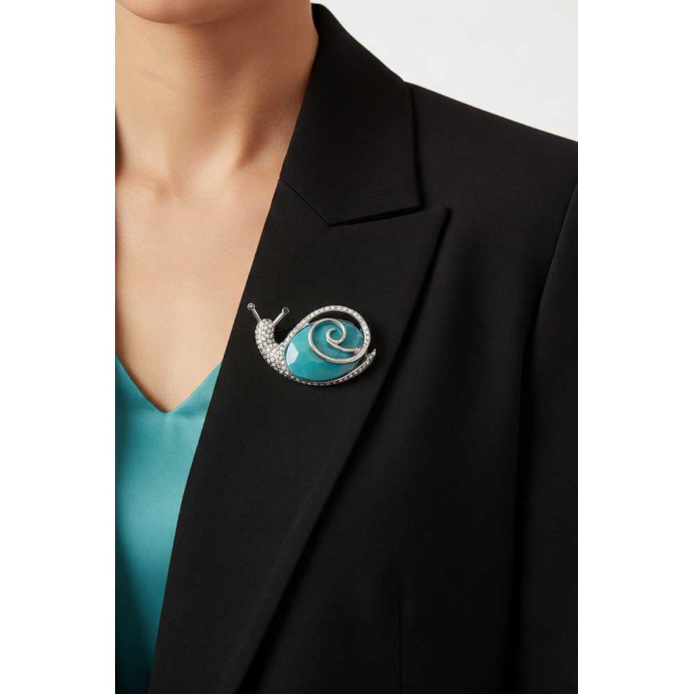 Model wearing Blue snail brooch pin on a black jacket - Lilylin Designs