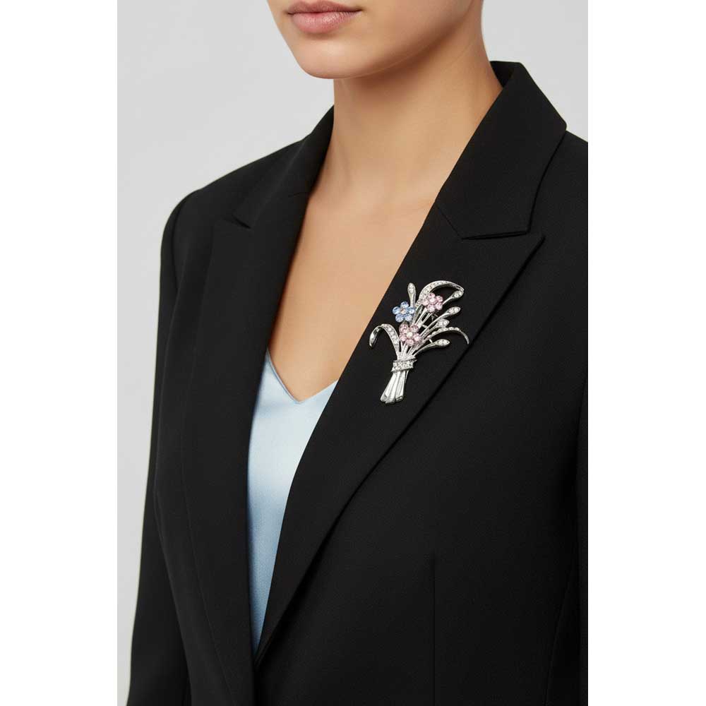 Model wearing Bouquet of pastel crystal daisies brooch pin on a black jacket with a light blue top - Lilylin Designs