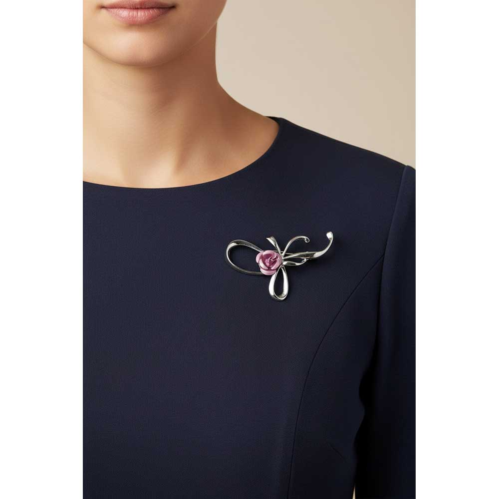Model wearing Bow with pink rose brooch pin on a navy blue dress - Lilylin Designs