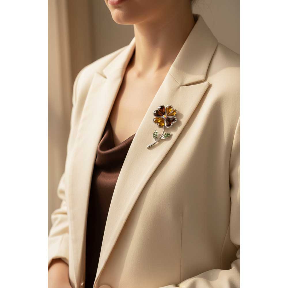 Model wearing Brown and gold sunflower brooch pin on a cream jacket over a brown top - Lilylin Designs