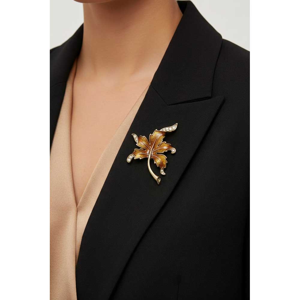 Model wearing Brown enamel and crystal maple leaf brooch pin on a black jacket with a light brown shirt - Lilylin Designs