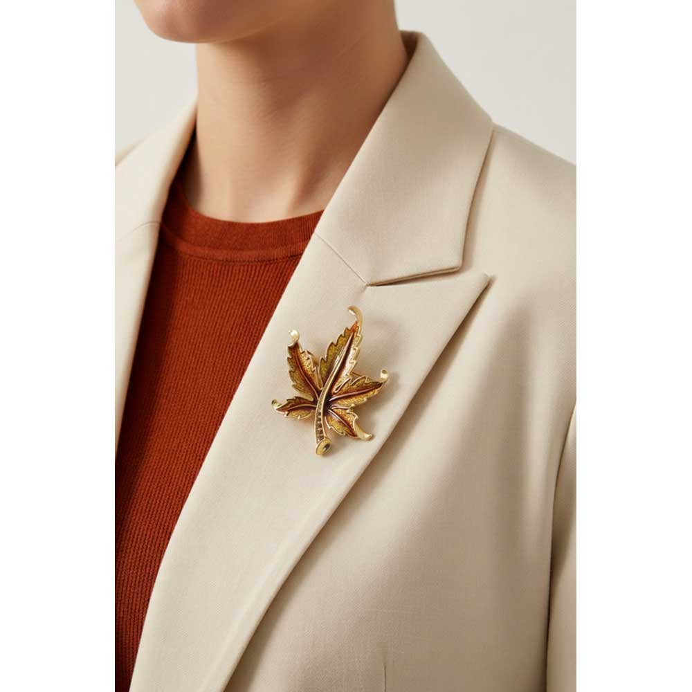 Model wearing Brown maple leaf brooch pin on a cream jacket - Lilylin Designs