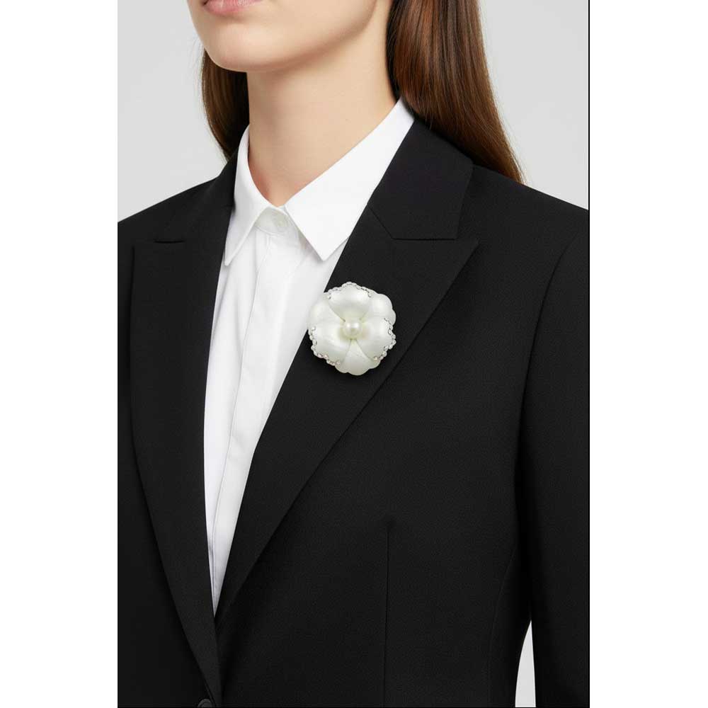 Model wearing Cream flower with pearl brooch pin on a black jacket with a white shirt - Lilylin Designs