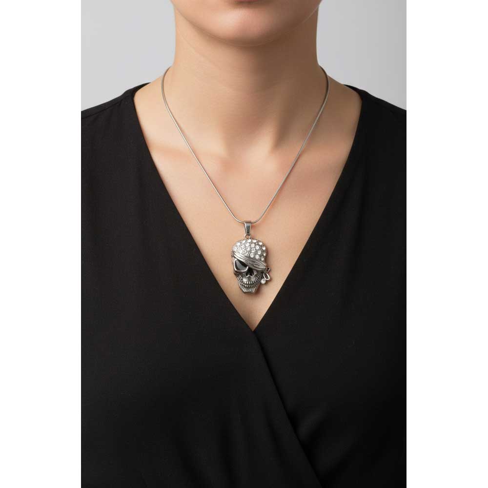 Model wearing Crystal bandaged skull necklace with a black v neck top - Lilylin Designs
