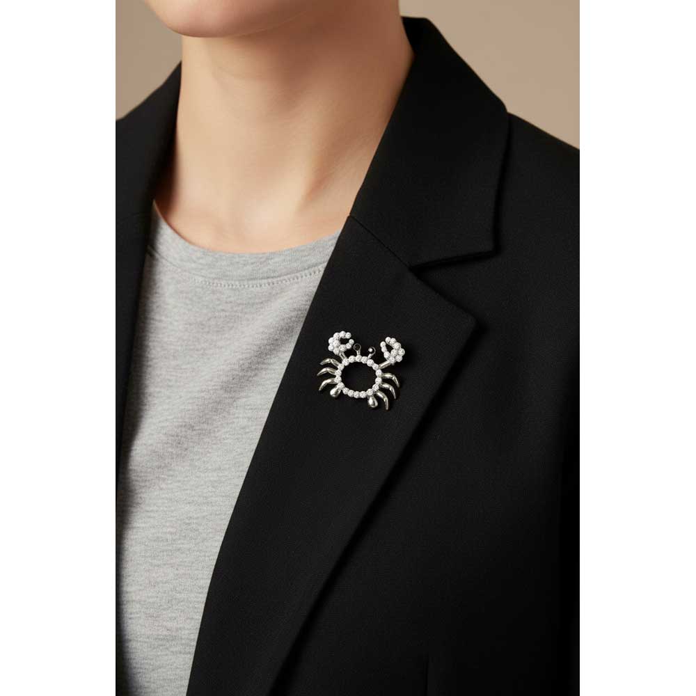 Model wearing Crystal crab brooch pin on a black jacket with a gray t-shirt - Lilylin Designs