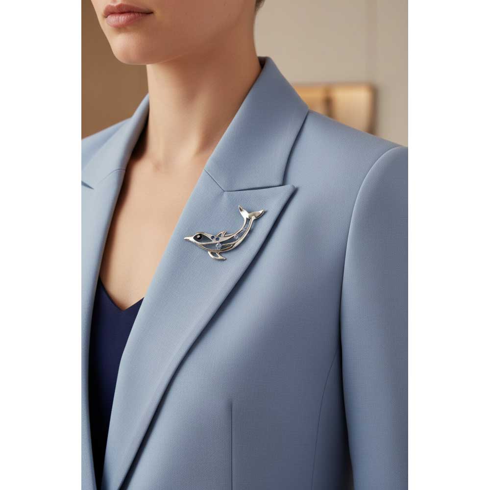 Model wearing Cut-out dolphin brooch pin on a blue jacket - Lilylin Designs