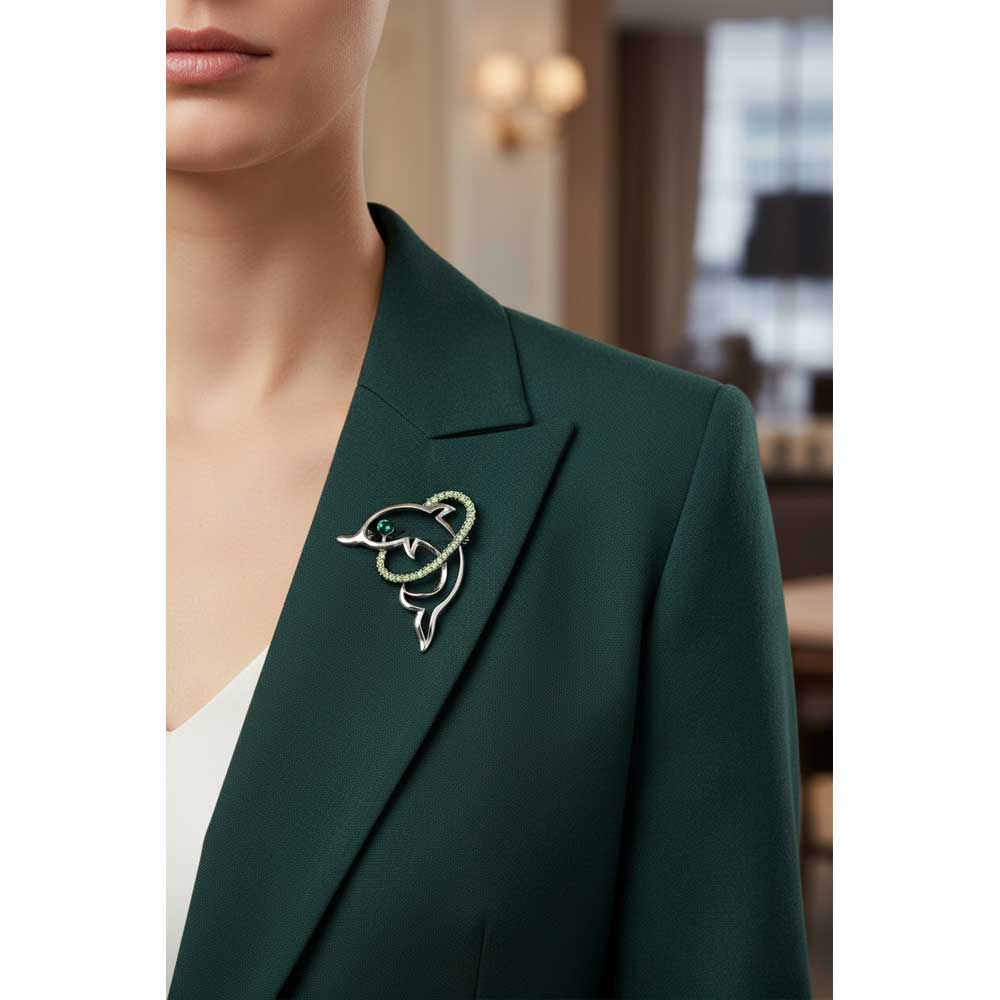 Model wearing Dolphin with hoop brooch pin on a green jacket - Lilylin Designs