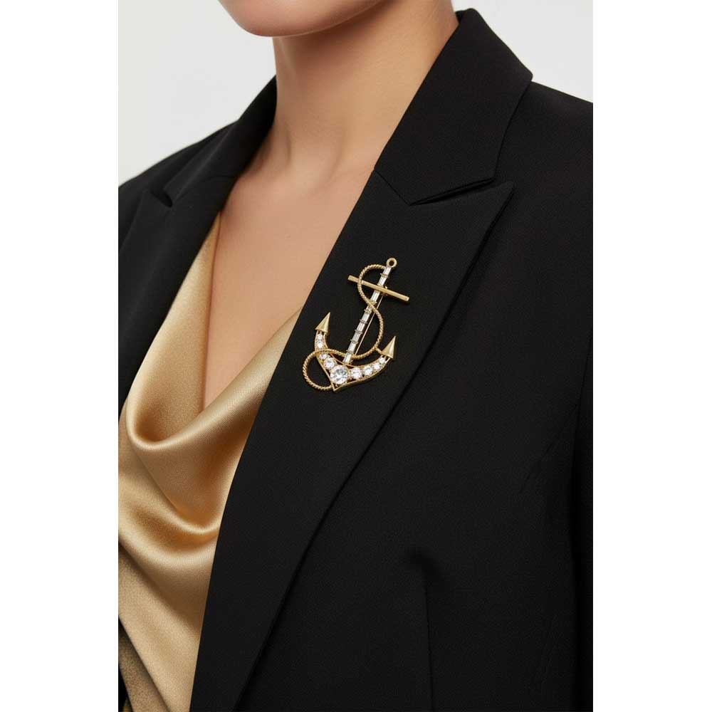 Model wearing Gold anchor brooch pin on a black jacket with a gold top - Lilylin Designs