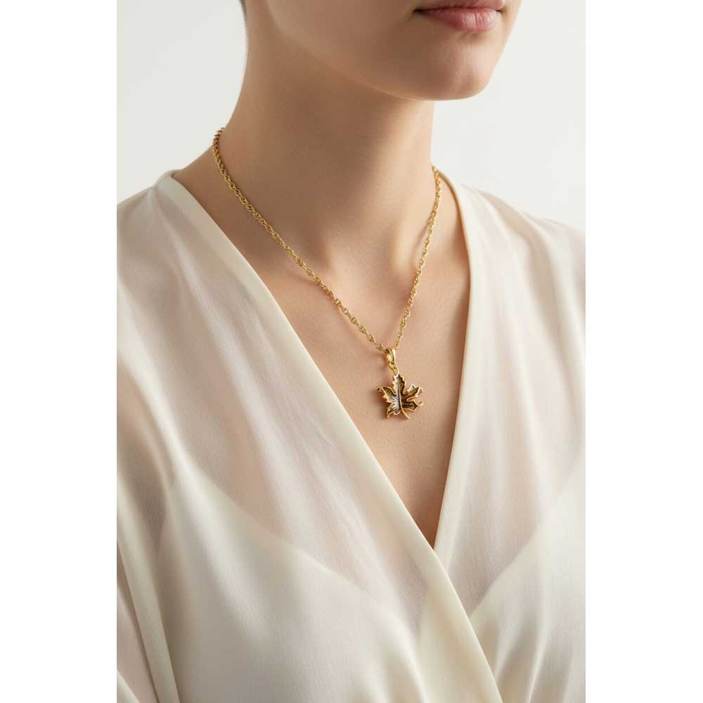 Model wearing Gold maple leaf necklace with a sheer top - Lilylin Designs