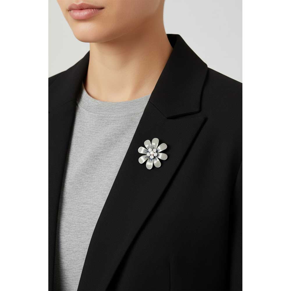 Model wearing Gray enamel flower brooch pin on a black jacket with a gray top - Lilylin Designs